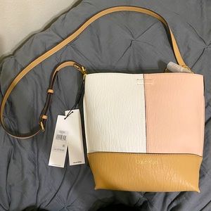 Calvin Klein reservable bag w/ detachable wallet.